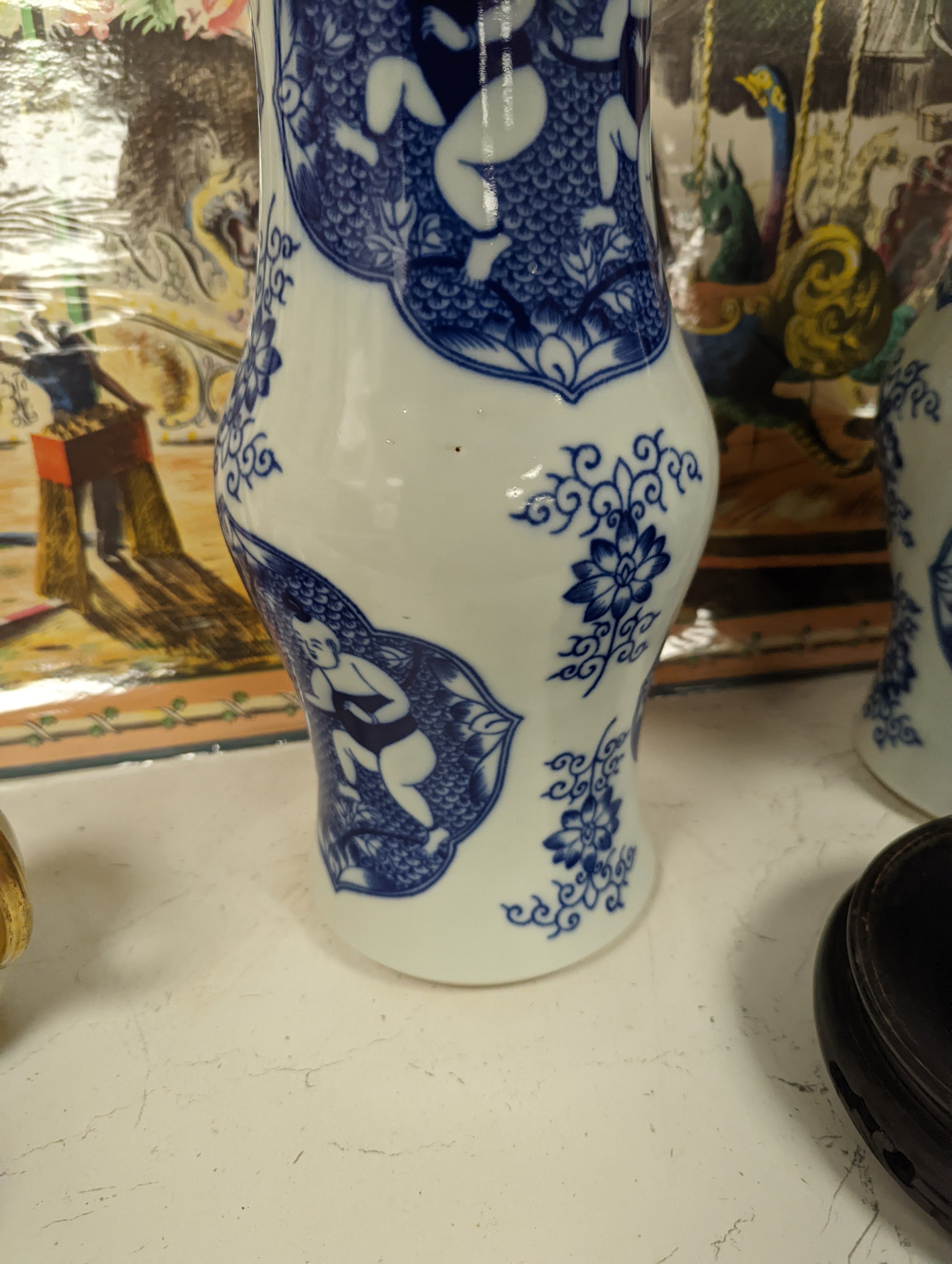 A pair of Chinese blue and white vases on stands and 4 further wood stands. Vases 35cm